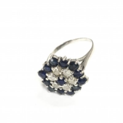 An unmarked white gold sapphire and diamond cluster ring. Size O 1/2 and 5.60g Postage B