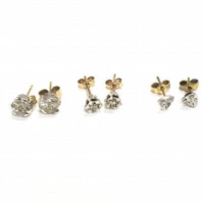 Three pairs of 9ct gold diamond stud earrings. 3.16g