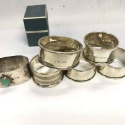 A collection of various silver napkin rings. 110g total.