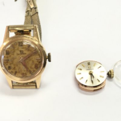 An 18ct gold cased vintage ladies omega watch with an additional omega movement. Postage B