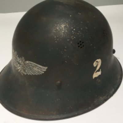 A Czech Luftschutz helmet good original condition with applied number 2 winged Third Reich front badge original lined and with applied labels.