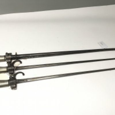 A French stick bayonet numbered E6142 steel scabbard and two other French stick bayonets with hook quilon (3)
