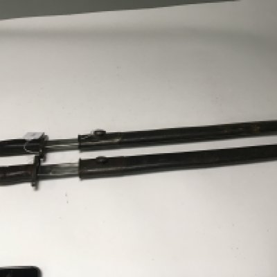 Two British Military bayonets early 20th century made by Wilkinson 1907 both with the crown stamp makers stamp and other military record stamps to the blade leather scabbards with metal fittings (2)