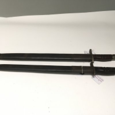 Two I world war Remington bayonets one stamped 1913 with British military issue reference marks to the blade the other stamped 1917 wit US stamp. Both with leather scabbard and metal fittings (2)