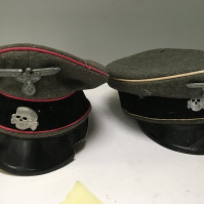 A German Third Reich officers Waffen SS panzer hat with rose pink piping damaged vizier one other SS officers hat and a German Luftwaffe officers hat these appear to be genuine but show signs of wear (3)