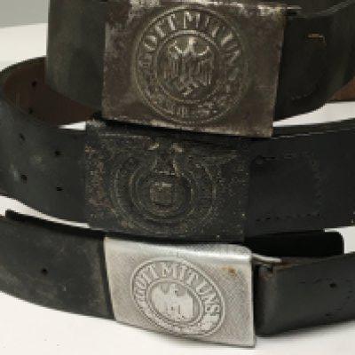 ThreeGerman Third Reich military issue belts with buckles one possible Hiltler Youth with the Eagle above Swastika with a laura. (3)