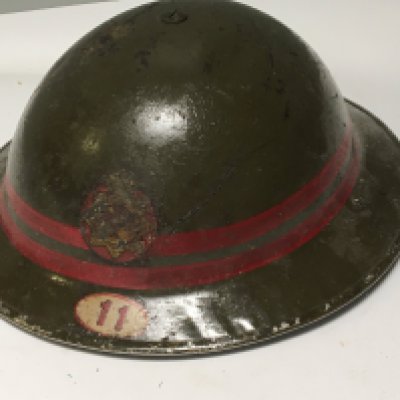 A II world war National Fire Service issue helmet with badge and 11 decal and a set of buttons .
