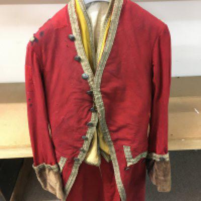 An 18th century red frock coat with waist coat. Postage category C