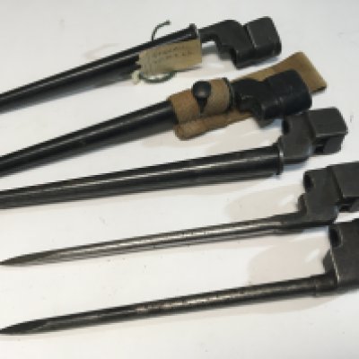 A collection of five of British Military issue Spike bayonets most with serial numbers three with steel scabbards (5)