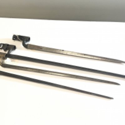 A collection of four long steel spike bayonets British 19th century issue with fixed sockets and possibly Russian (4)