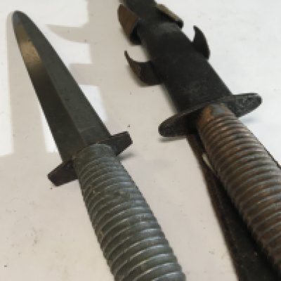 A Fairbrain Sykes Commando fighting knife and one other possible II world war issue Third pattern one with obscure marks to the cross guard. (2)