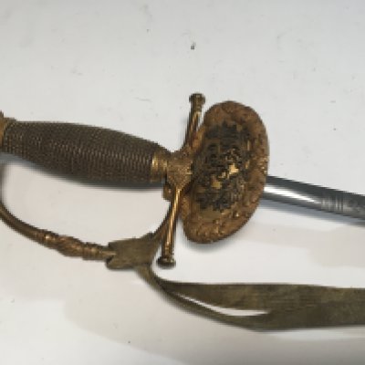 A Quality William IV British Diplomatic Court sword with gilt decoration hanging pommel and raised Kings Cypher engraved blade.