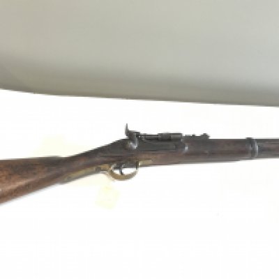 A 19th century Indian Military issue Rifle with brass trigger steel ram rod early breech loading mechanism. Indian military marks.