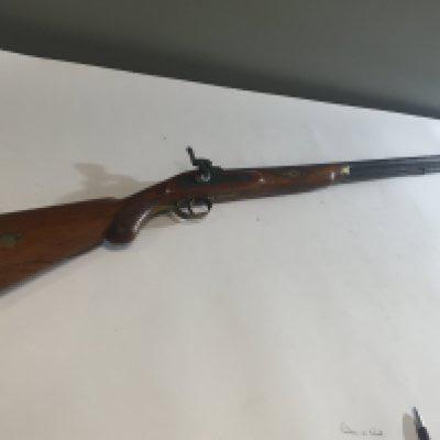 A 19th century Percussion Rifle with half length stock muzzle load sporting gun with brass fittings.