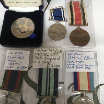 A collection of medals comprising Canadian Volunteer medal 1939 Indian Service Medal Australian War medal George V Police medal Elizabeth II Police medal with a Police Medallion