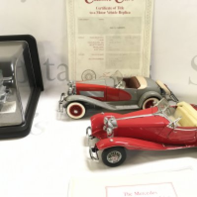 A Boxed (with Case) Franklin Mint 1907 Rolls-Royce Silver Ghost. A Danbury Mint Duesenberg And A Mercedes 500K Special Roadster.(3).