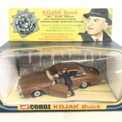 A Boxed Corgi Kojak Buick #290 With Repro Badge And Inserts.