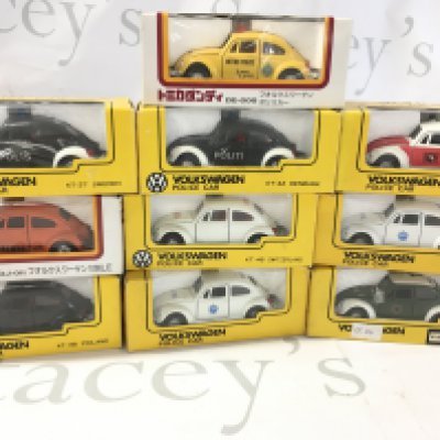 A collection of 10 boxed diecast model Volkswagen Beetle cars each done in police livery from numerous countries. Manufactured by Tomica etc. no reserve