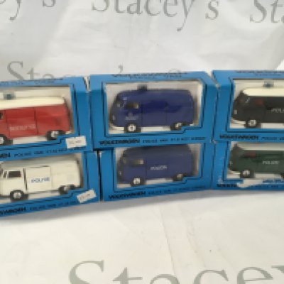 A collection of 6 boxed diecast model Volkswagen cars in police livery. Manufacturer Caddo. No reserve.