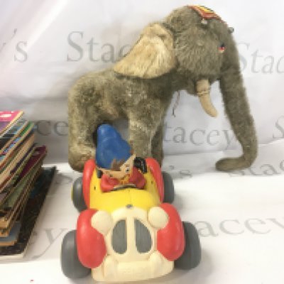 A box containing a vintage toy circus elephant..a Bendy Noddy Car and several hundred comics with titles including Starblazer..Tornado..Judge Dredd plus others including no.1 issues. No reserve.