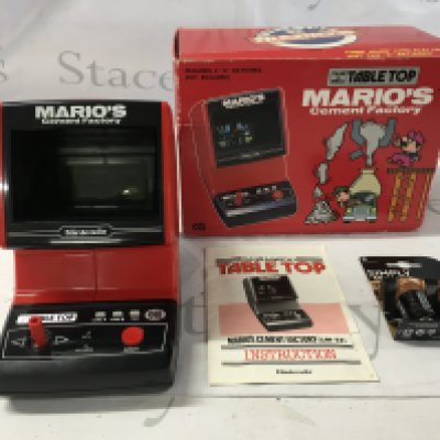 A boxed Table Top Game and Watch&hellip;.Marios Cement Factory in working order. Includes instructions. No reserve