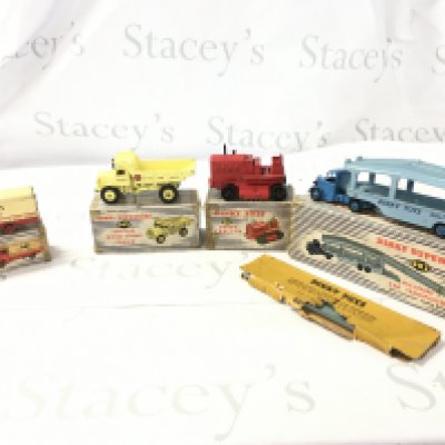 A Collection of 4 vintage boxed Dinky vehicles featuring construction and commercial pieces. Includes 917..963..965..982. Boxes are worn and track on 963 perished. No reserve