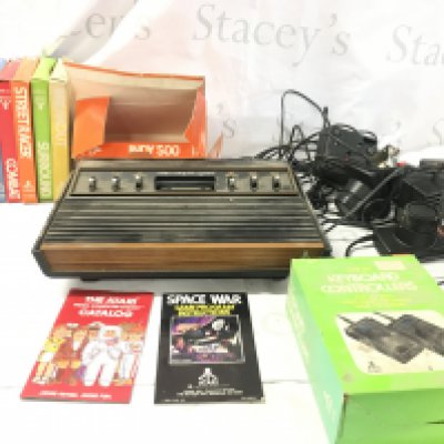 Atari CX2600 video computer system..includes console..controllers and power supply..a number of games cartridges. No reserve