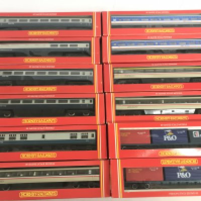 A Collection Of Boxed Hornby 00 Gauge Coaches And Freightliner Wagons.