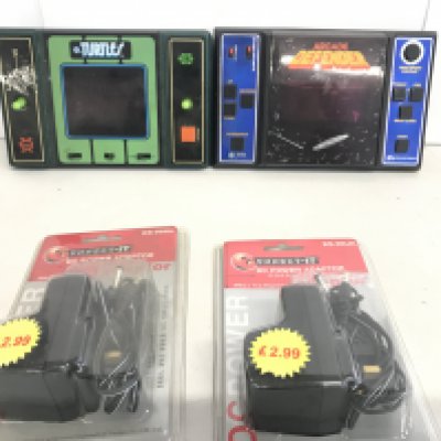 A Entex Electronics Defender Hand Held Console And A Turtles Game. With 2 Transformers.