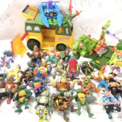 A Box Containing A Large Collection Of Teenage Mutant Hero Turtles Figures And Accessories. No Reserve.