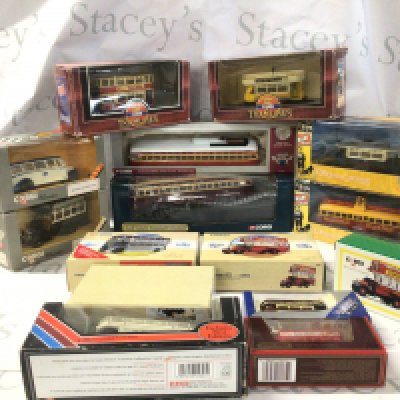 A collection of boxed model buses and trams by Corgi and others.