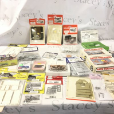 A collection of model railway accessories mostly in unopened kit form comprising buildings, vehicles etc. 00 gauge. No reserve