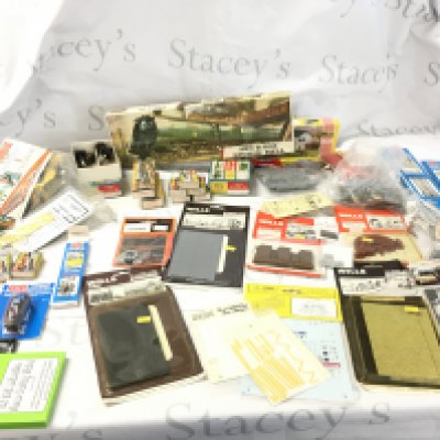 A mixed selection of 00 gauge minature railway accessories mostly sealed by various manufacturers . Comprises scenery..buildings..track etc. Also includes an unstarted Airfix kit model locomotive Biggin Hill. No reserve