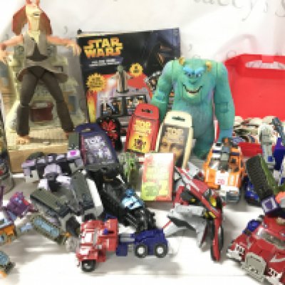A Collection Of Playworn Toys Including Transformers. Star Wars. Top Trumps. Etc.
