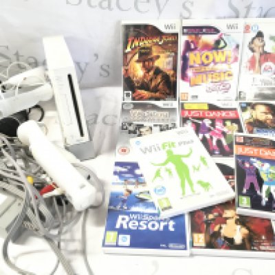 A Nintendo Wii with A Collectible Of Games And Accessories.