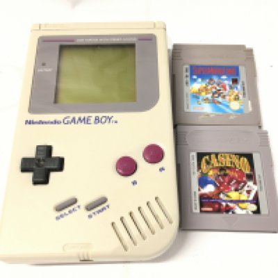 A Nintendo Gameboy With Two Games.