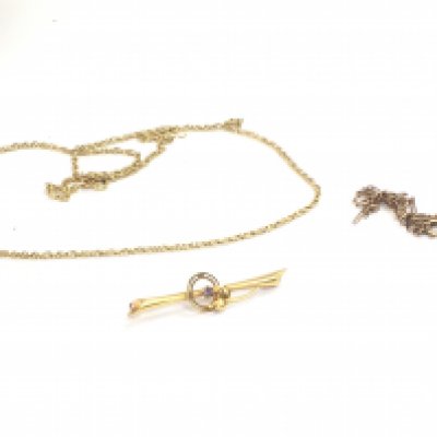 Two 9 carat gold chains and a gold brooch with a metal pin. Total weight 8.3G. Postage category A