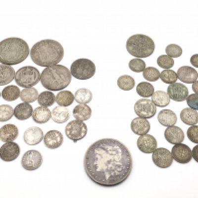 A collection of pre 1920 and pre 1946 coinage. Including a 1890 O morgan dollar. Approximately 160g total. Postage A