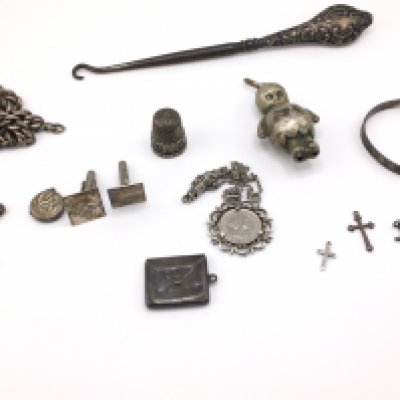 A collection of assorted silver items including cross pendants a charm etc. Postage B