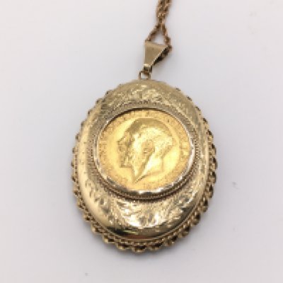 A 1918 full sovereign set in a 9ct locket on a 9ct chain. Total weight 24.95g Postage B