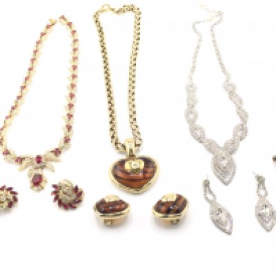 Three costume jewellery sets and a cameo brooch. Postage B