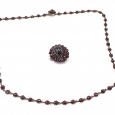 A vintage garnet necklace and brooch. Postage B