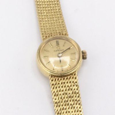 A vintage 18ct gold omega ladies wrist watch circa 1960. Winds and runs. 31.19g