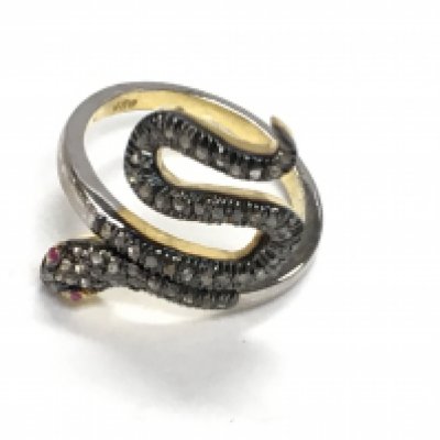 Unusual silver gilt snake ring set with 50 rise cut diamonds totalling 0.27ct, and 2 rubies totalling 0.04ct. Ring size Approx O. Postage category A.