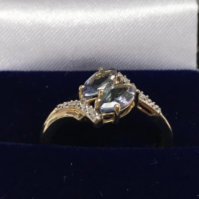 9ct yellow gold double marquise cut lilac tourmaline and diamond ring. Boxed. Ring size Approx P. Postage category A.