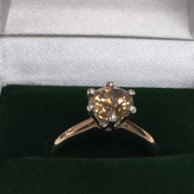 Certificated 18ct rose and white gold 6 claw set RBC diamond solitaire ring, boxed. Fancy orangish brown diamond 1.82ct. Cert no. WGI9624140506. Ring size Approx M. Postage category A.