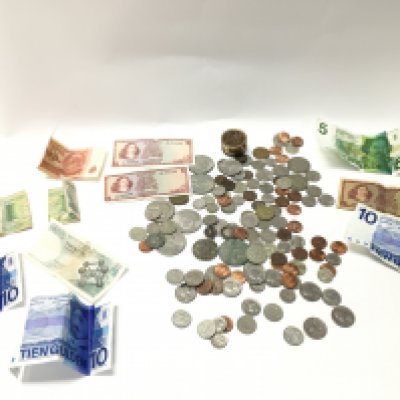 A collection of assorted world coinage and bank notes. Postage B