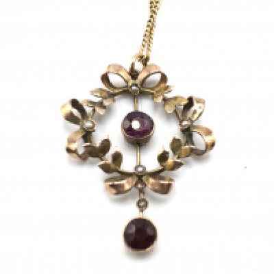 An Edwardian brooch on a 9ct gold chain. 5.17g total. Postage A