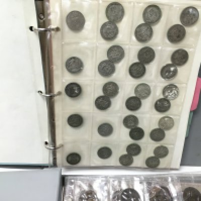 Two albums of coinage including pre 1946 Postage B