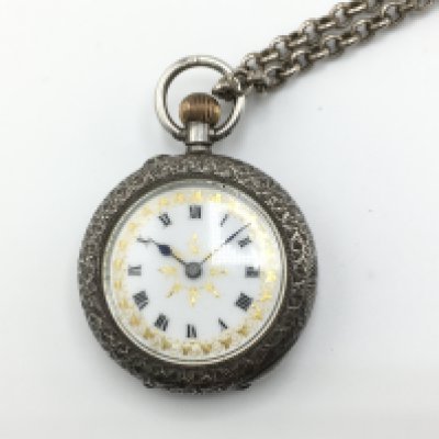 A silver case with enamel face ladies pocket watch with silver belcher style chain. Total weight 53.11g Not seen running. Postage B
